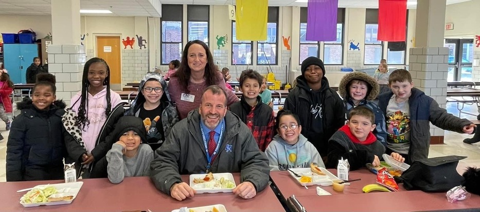 Mr Jansen visiting Brick cafeteria with 3rd grade students